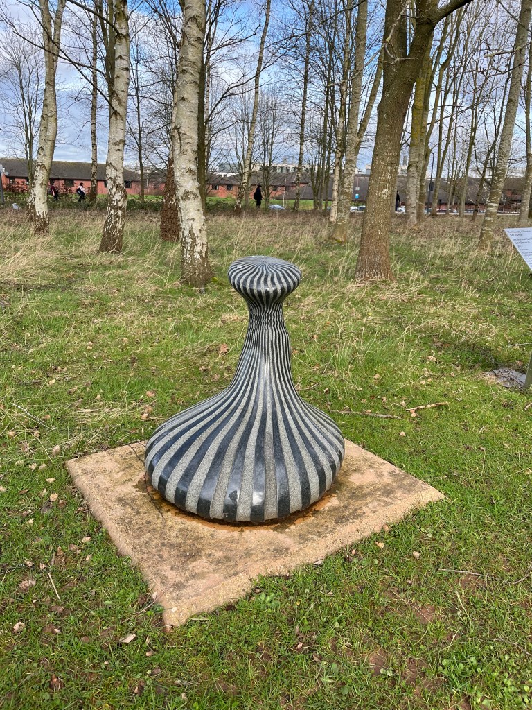 Jon Isherwood, Song (Version V), 2017, black granite, University of Warwick campus.