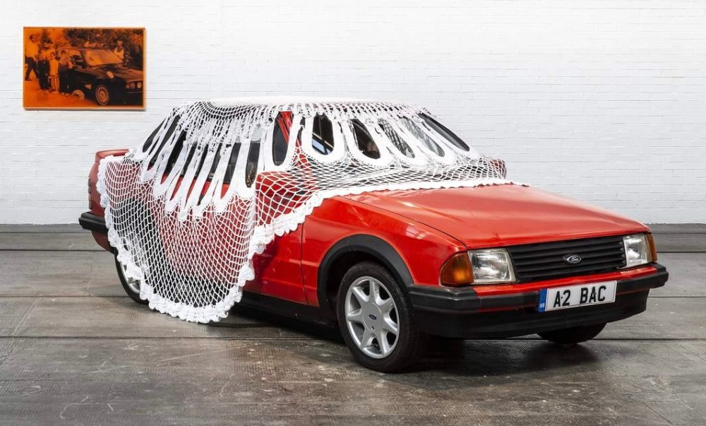 Jasleen Kaur, Alter Altar, 2024, Red Escort, cotton doily, sound sister playing pop and devotional songs.