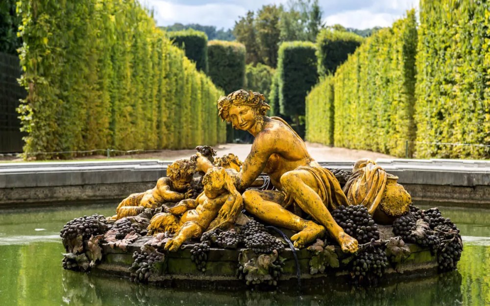 Bacchanalian sculpture in the Gardens of the Palace of Versailles, Paris.
